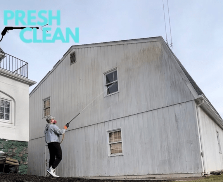 Team member washing a house in Irvington, NY.